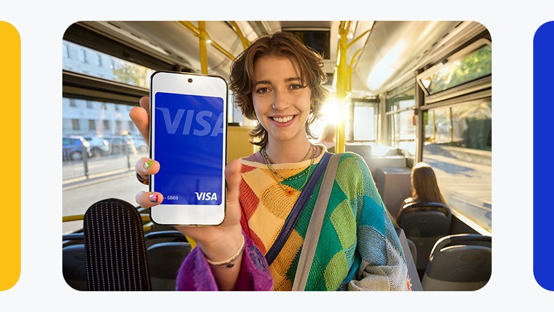 Woman paying by phone on a bus